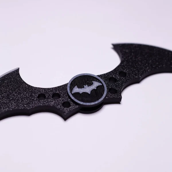 A detailed 3D printed Batman batarang keychain with bat logo, exclusively from Print3D.pk.