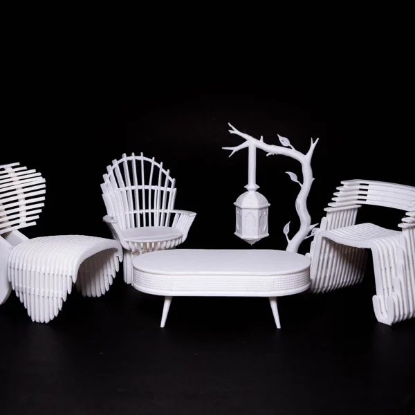 White 3D printed miniature furniture set featuring chairs and a table by Print3D.pk.