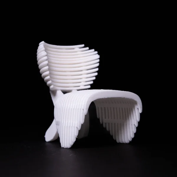 White 3D printed modern chair model with ribbed design by Print3D.pk