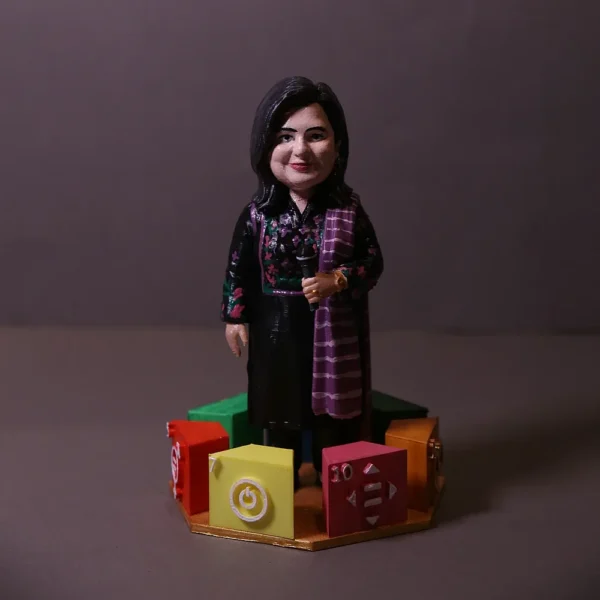 Custom 3D printed woman figurine standing on a colorful gaming controller base by Print3D.pk.